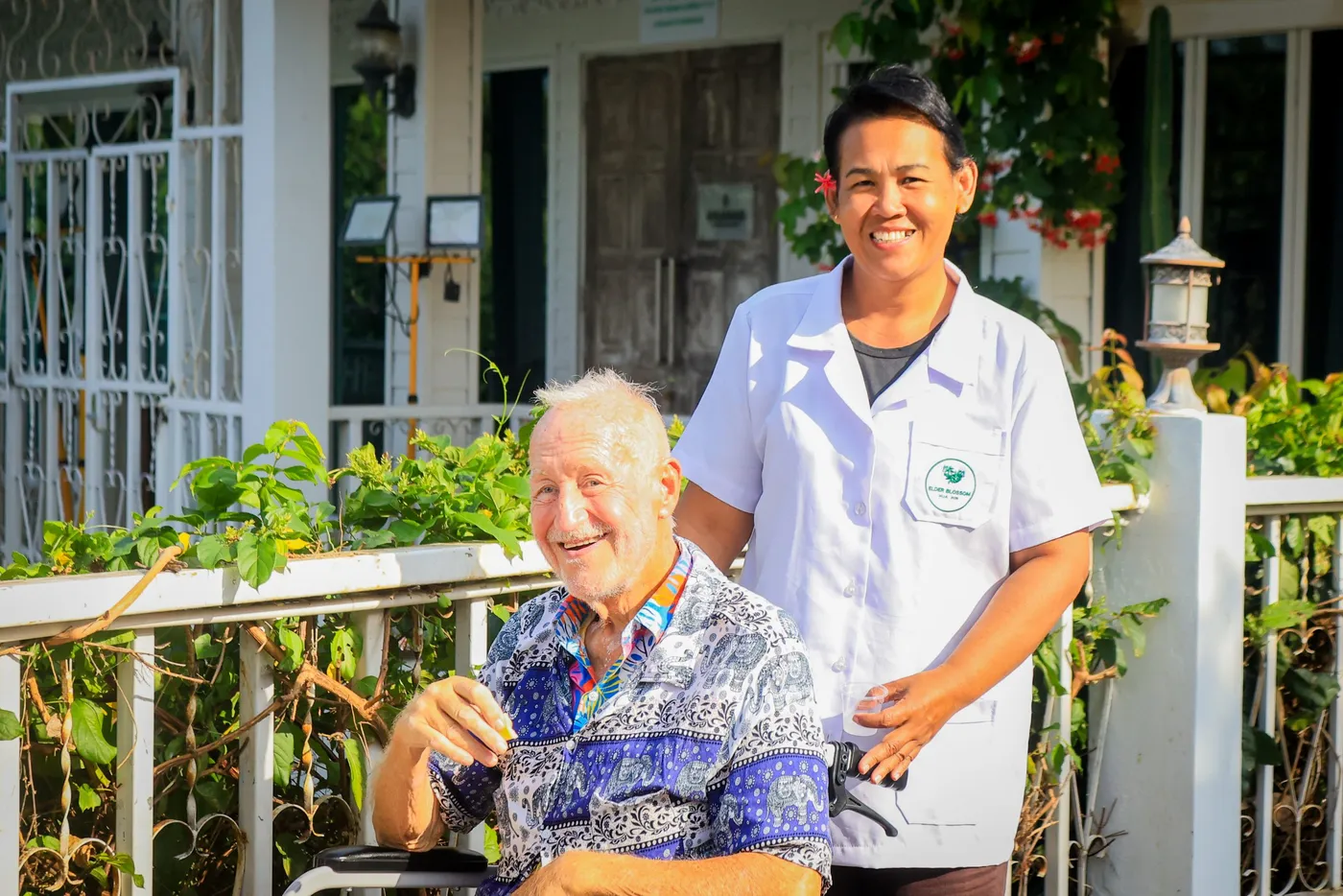A member of the Elder Blossom team assisting a resident